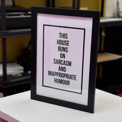 Funny wall art print featuring the words this house runs on sarcasm and inappropriate humour